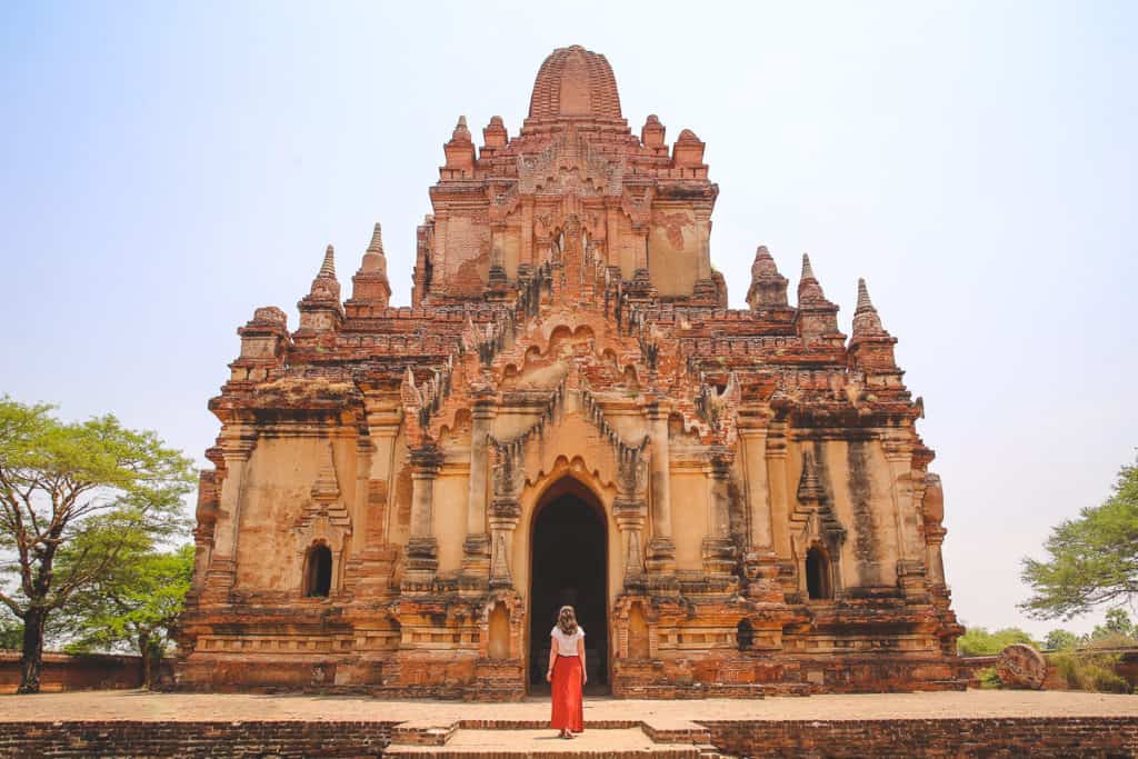 Girl standing in front of a temple